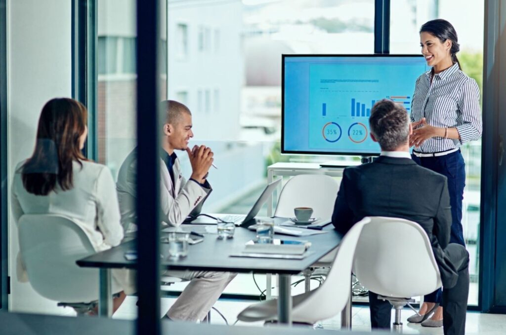 Startup funding pitch meeting in NYC with entrepreneurs presenting to venture capital investors