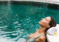Candlelit thermal bath pools at AIRE Ancient Baths Tribeca representing urban wellness NYC 2026