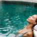 thermal bath pools candlelight spa interior New York - NYCwebzine Candlelit thermal bath pools at AIRE Ancient Baths Tribeca representing urban wellness NYC 2026