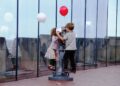 children explore a hands-on exhibit together, enjoying rainy day activities for kids in New York City