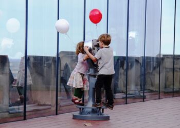 children explore a hands-on exhibit together, enjoying rainy day activities for kids in New York City