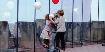 children explore a hands-on exhibit together, enjoying rainy day activities for kids in New York City