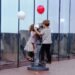 children explore a hands-on exhibit together, enjoying rainy day activities for kids in New York City