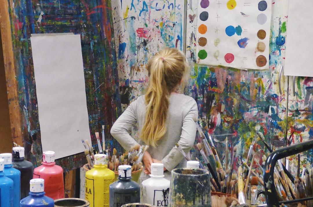 a kid painting at a creative art studio, a perfect rainy day indoor activity for kids in NYC
