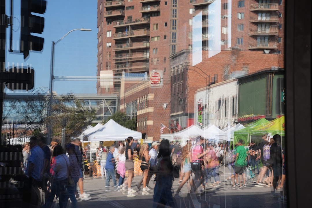 Visitors walking through PrideFest street fair booths during NYC Pride in Greenwich Village