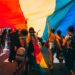 pride-parade-celebration-unsplash - NYCwebzine Thousands of people lining Fifth Avenue to watch the NYC Pride march, waving rainbow flags in Manhattan