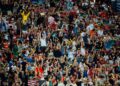 soccer-fans-cheering-bar-crowd-unsplash - NYCwebzine Excited soccer fans cheering together at a New York City bar during a World Cup match screening