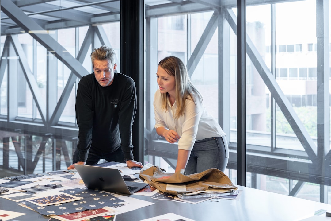Two professionals meet to discuss small business compliance strategy and next steps in New York City