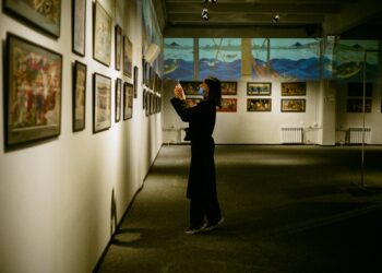 A visitor examines artifacts inside one of New York City's hidden museums in a quiet Lower East Side gallery