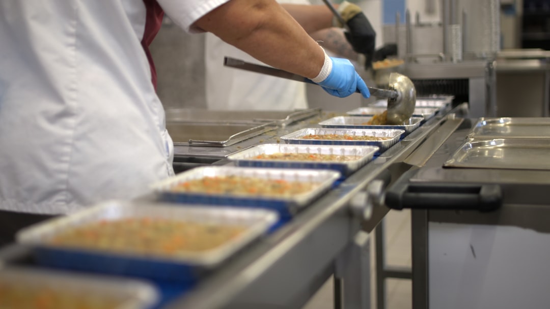 A female founder scaling her food startup using affordable shared kitchen space in Brooklyn