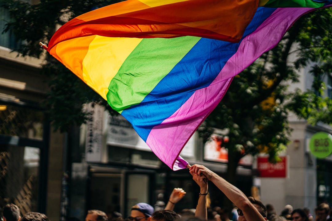 Young marchers carrying rainbow flags during the NYC Pride march through the streets of Manhattan