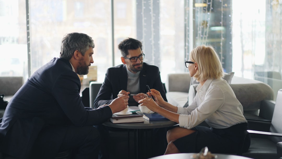 A tenant and broker discussing commercial lease terms and rent figures in a Manhattan office building