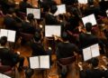 conductor-orchestra-performance-on-stage-unsplash - NYCwebzine A conductor leads the Festival Orchestra of Lincoln Center in a Mostly Mozart concert at David Geffen Hall