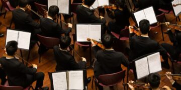 conductor-orchestra-performance-on-stage-unsplash - NYCwebzine A conductor leads the Festival Orchestra of Lincoln Center in a Mostly Mozart concert at David Geffen Hall