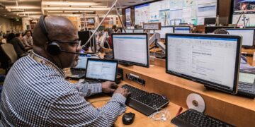 engineer-working-in-a-center-unsplash - NYCwebzine Engineers working on New York power grid highlighting data center moratorium energy concerns, max 100 chars