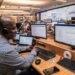 engineer-working-in-a-center-unsplash - NYCwebzine Engineers working on New York power grid highlighting data center moratorium energy concerns, max 100 chars