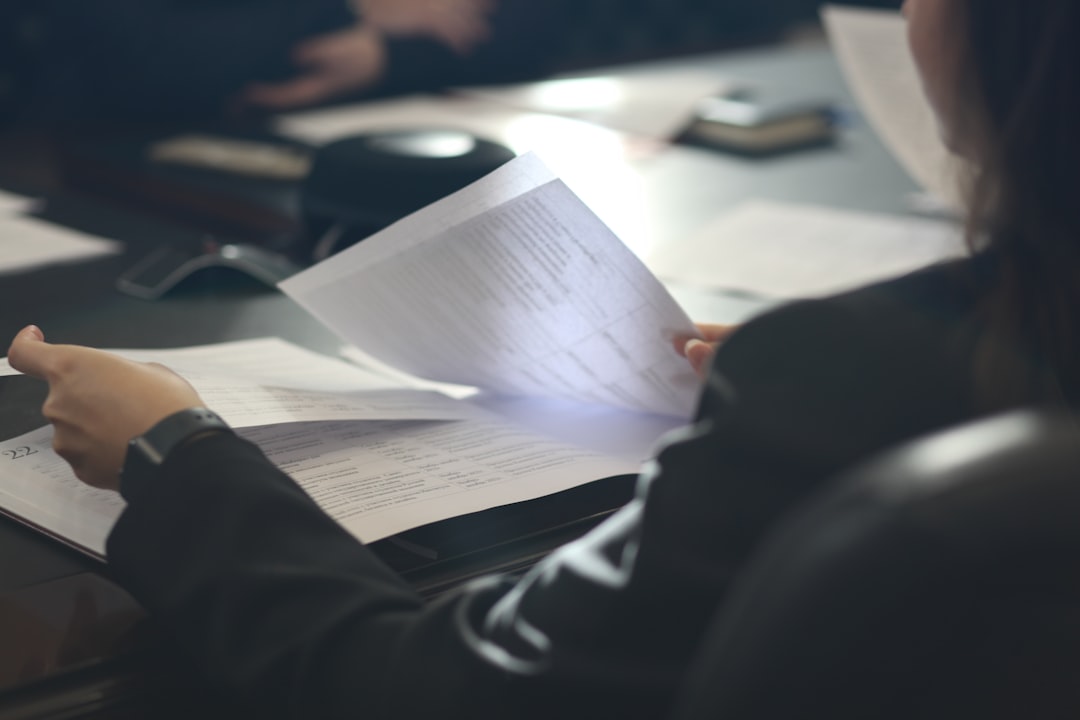 A small business owner carefully reading a commercial lease document before negotiating renewal options in New York City
