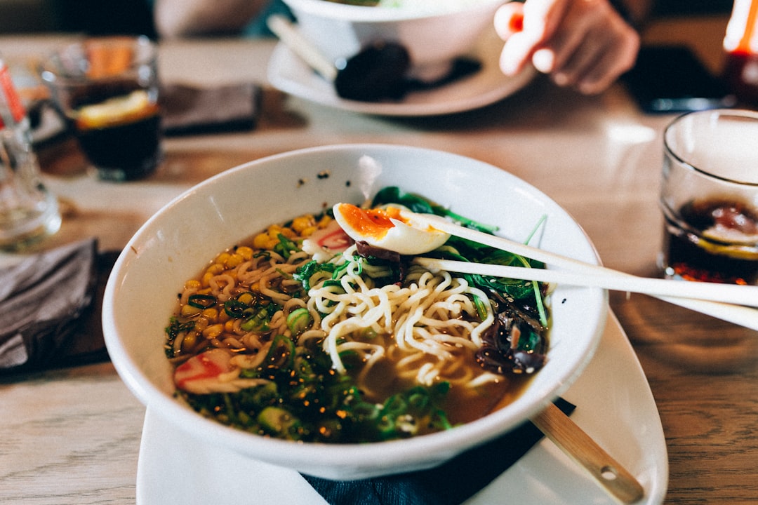 A couple shares a meal at a New York City ramen shop known for its handcrafted broth and noodles