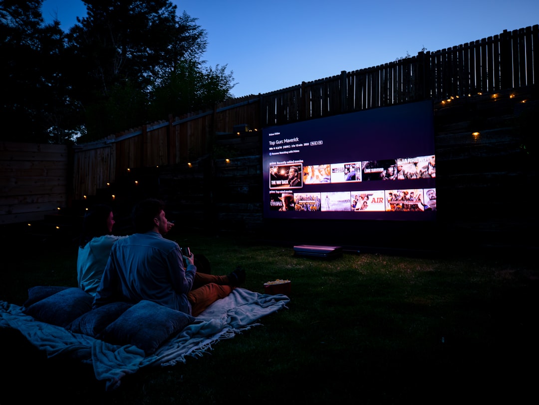 Family enjoying a free outdoor movie screening, one of the most popular free outdoor kids activities in New York City parks.
