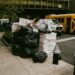 overflowing-trash-bags-on-nyc-unsplash - NYCwebzine overflowing garbage bags and cardboard boxes piled on New York City sidewalk at night beside a fire hydrant.