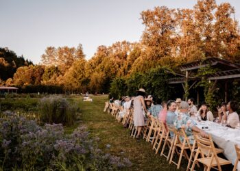 people enjoying outdoor dining at a lush restaurant garden terrace in New York City
