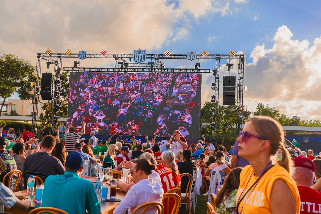 A family enjoying a FIFA World Cup fan zone event at a New York City waterfront venue