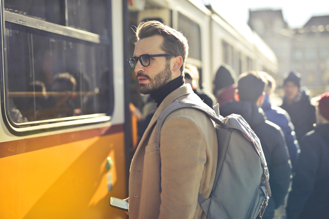 A traveler boards a commuter train at Penn Station for a Jersey Shore weekend escape from New York City