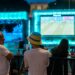 soccer-fans-cheering-big-screen-outdoor-unsplash - NYCwebzine A crowd of fans cheering at one of the FIFA World Cup fan zones on a large outdoor screen in New York City
