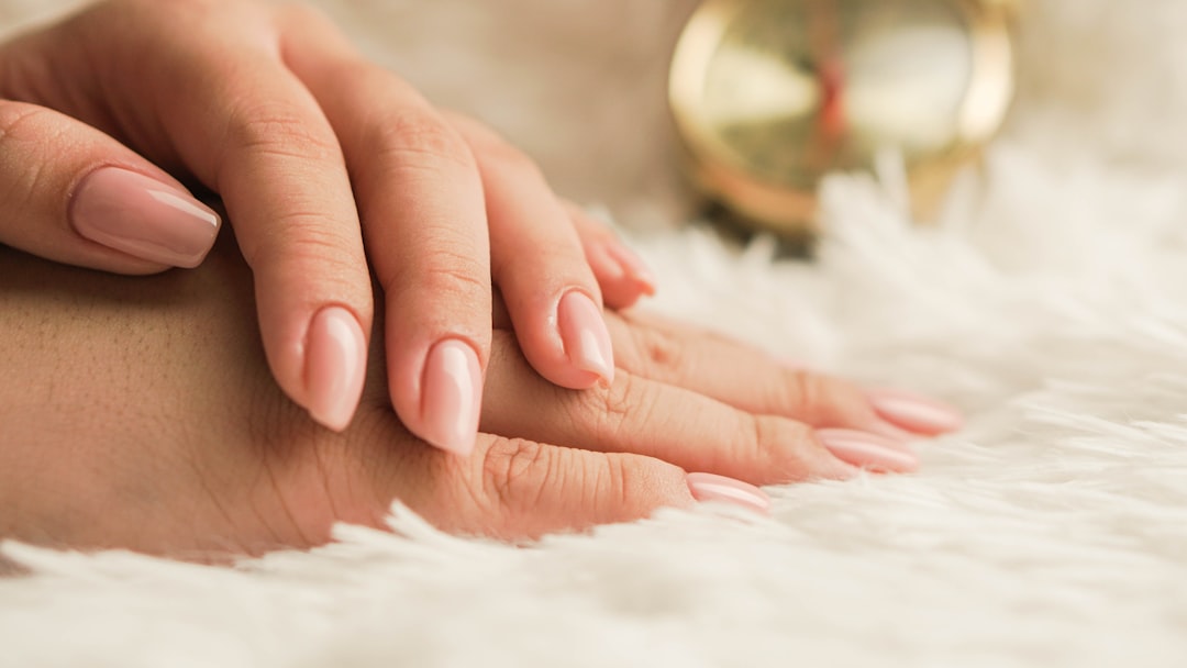Close-up of a woman's freshly painted nails after a lasting summer manicure at a top nail salon in NYC