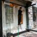 artist-in-painting-studio-new-york-unsplash - NYCwebzine A painter working at an easel in a New York studio space, representing the focused time that artist residencies provide.