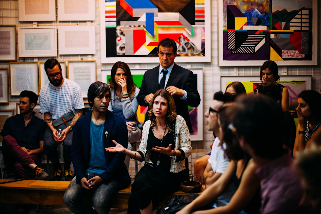artists in conversation inside a gallery, reflecting the community built through artist residencies in New York City.