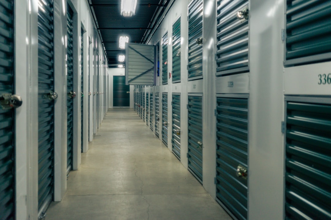 A commercial real estate professional inspects a row of storage units in a New York City self-storage facility.