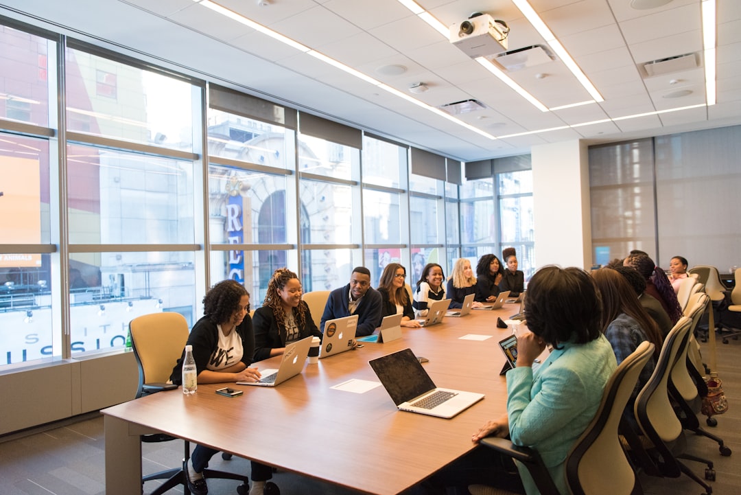A founder walks their first employee through onboarding documents in a New York City office