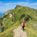 hiking-trail-woman-unsplash - NYCwebzine A woman hiking a forest trail in the Hudson Valley on an upstate escape from New York City