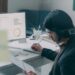 A financial analyst reviewing NYC REITs performance data on a screen in a Manhattan office