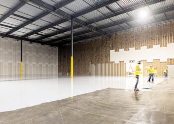 A small investor reviews documents inside a New York City storage units facility, assessing occupancy and returns data.