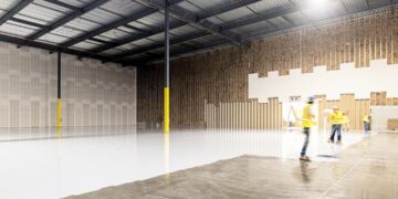 A small investor reviews documents inside a New York City storage units facility, assessing occupancy and returns data.