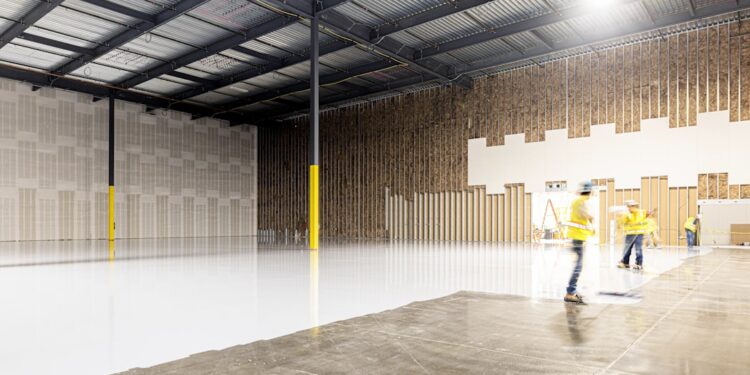 A small investor reviews documents inside a New York City storage units facility, assessing occupancy and returns data.
