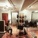 An independent artist recording vocals in an affordable studio space in New York City
