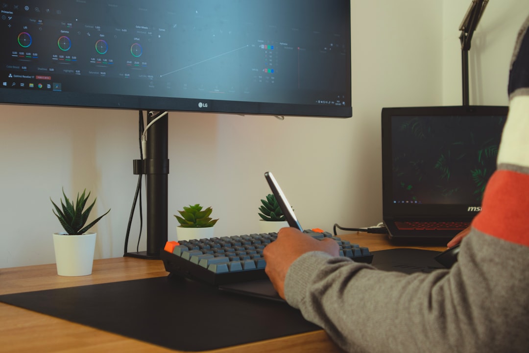 A retail investor buying NYC REITs shares on a laptop from a home workspace