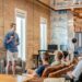 startup-pitch-meeting-unsplash - NYCwebzine A startup founder presenting to accelerator investors, preparing to pitch your business in a New York City conference room