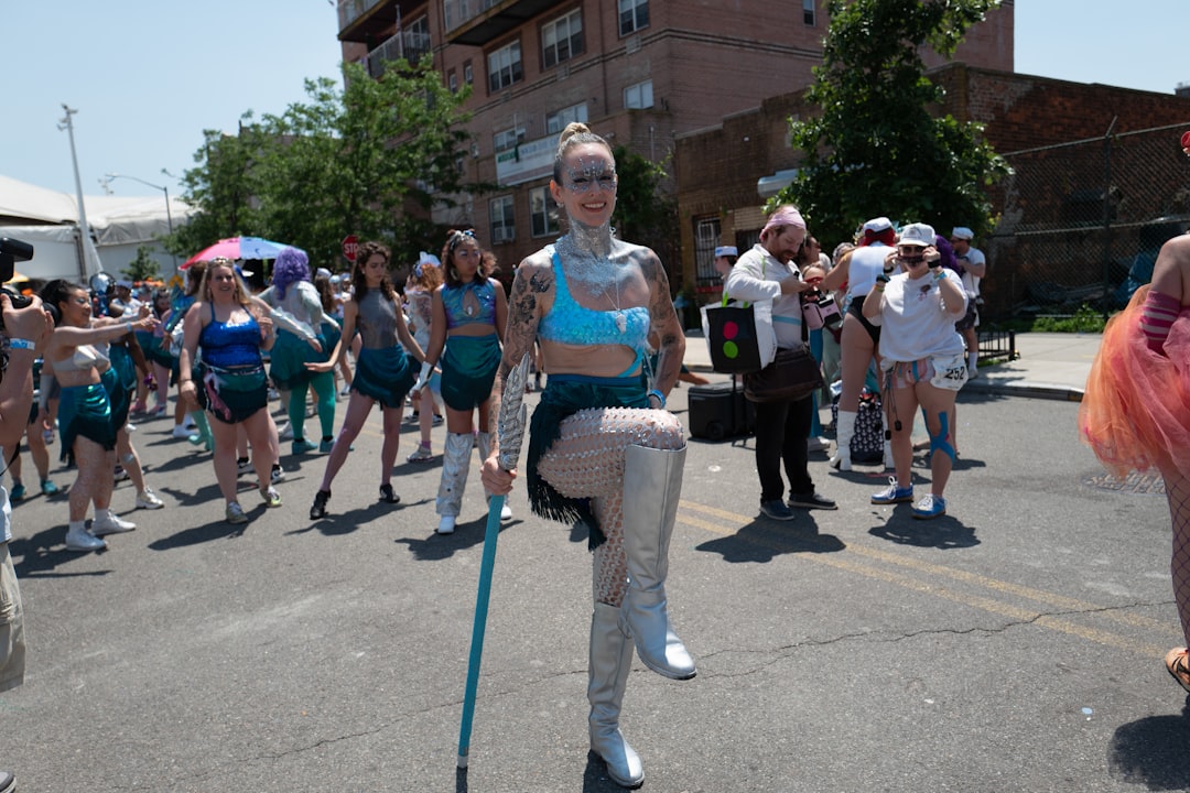 A woman dancing at a live street festival, one of many free outdoor concerts happening in New York City this Labor Day.