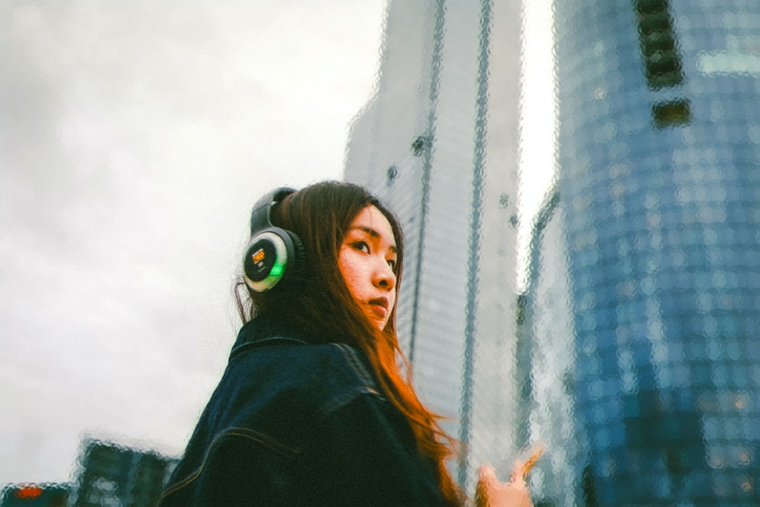 A young independent artist reviewing a track after a session in studio space in New York City