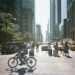 diplomat-crowd-city-street-new-york-unsplash - NYCwebzine A pedestrian walks past UN General Assembly security barriers on a busy Midtown Manhattan street
