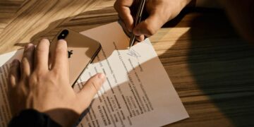 A New York City founder reviews an NDA document to protect a business idea before a pitch meeting