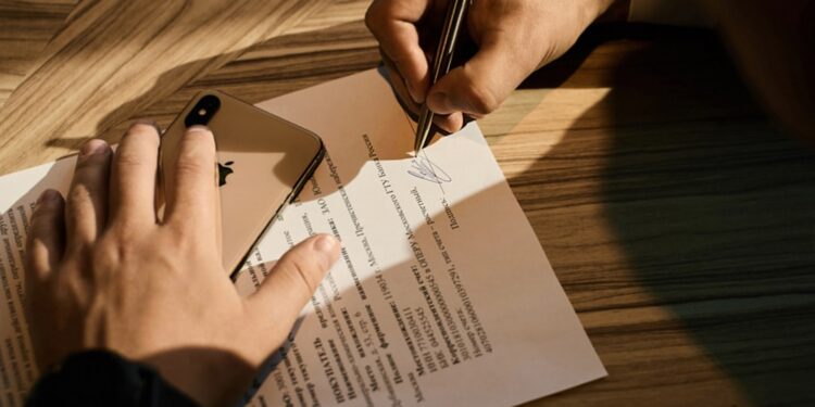 A New York City founder reviews an NDA document to protect a business idea before a pitch meeting