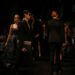 fashion-designer-backstage-runway-woman-unsplash - NYCwebzine An emerging designer adjusts a garment backstage before a New York Fashion Week runway show