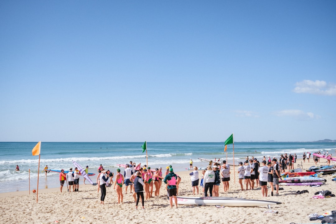 open-water swimmers gathered at the shore, capturing the community spirit of an NYC swimming club before a group ocean swim
