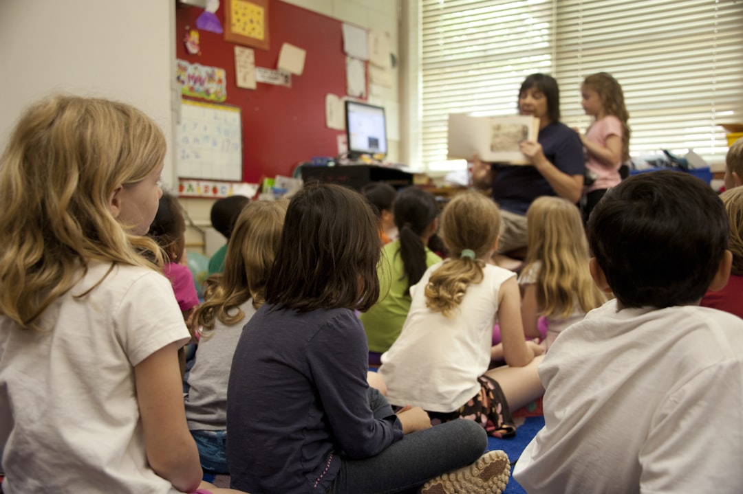 A teaching artist guiding a group of children through an after-school programmes creative session