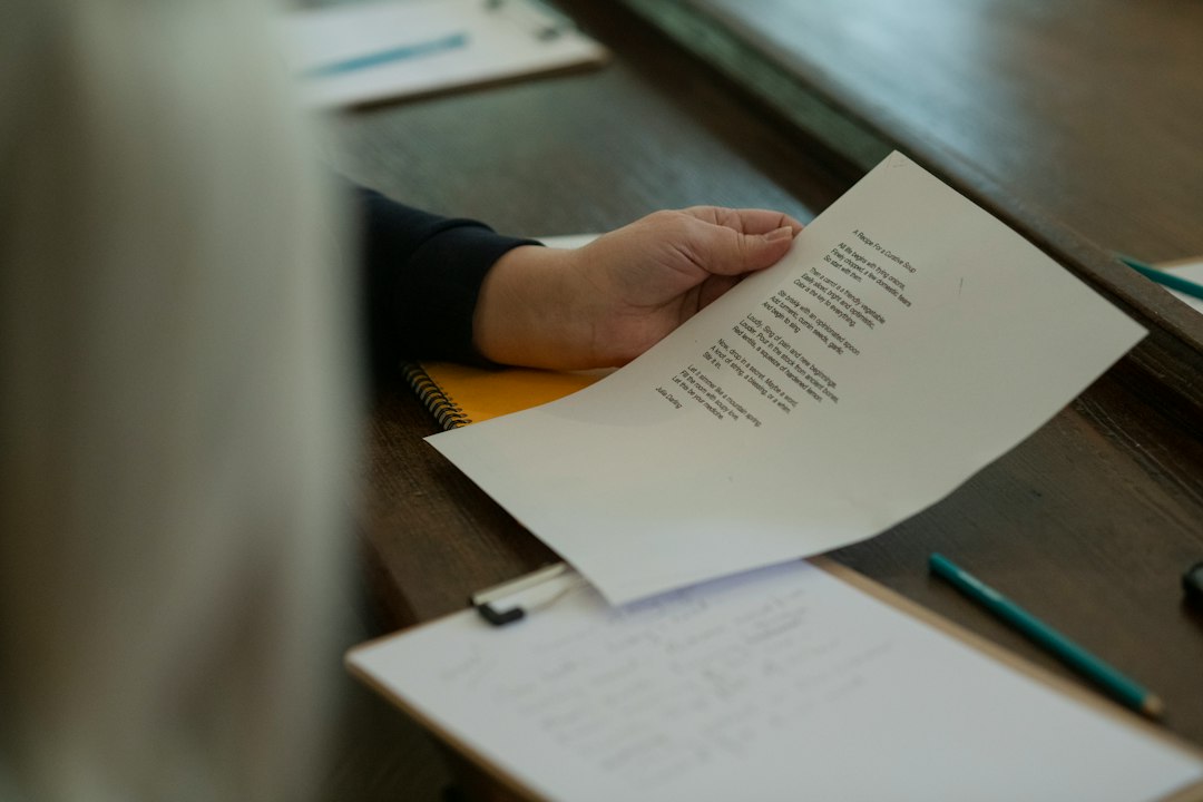 An NYC renter carefully reads a notice letter received at her front door